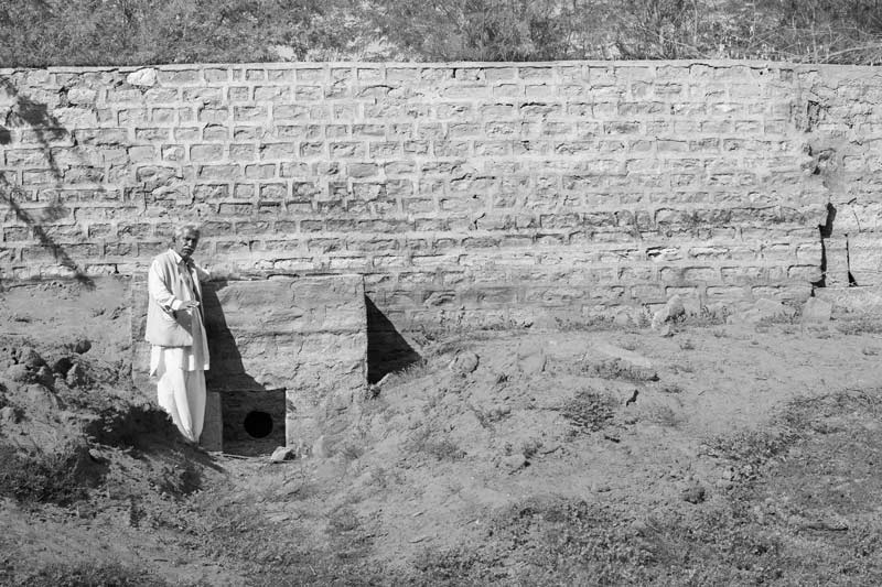 Chattar Singh Jam, the Water Wizard of Thar Desert, explaining about the structure and restoration work undertaken at Derasar 'khadin' in Jaisalmer district, Rajasthan